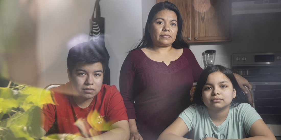 Yolanda Mendoza poses with her two children