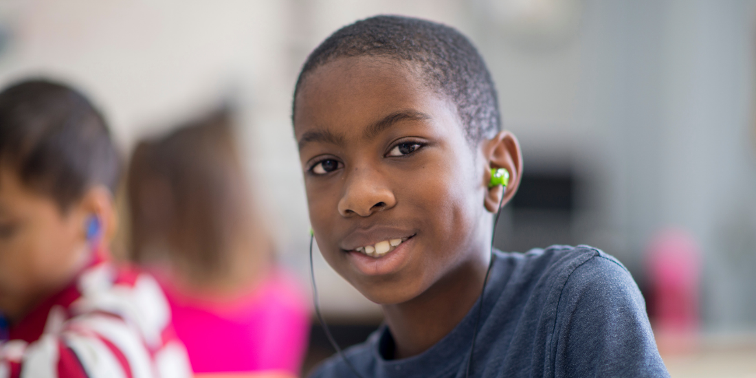 Middle School Student with earbuds