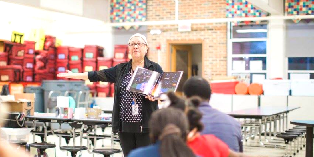 Mary Hernandez reading to students